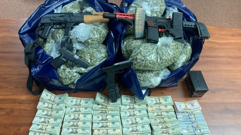 Pounds of marijuana, cash and guns were seized by the Butler County Sheriff's office drug unit when homes in Hamilton and Middletown were searched. BUTLER COUNTY SHERIFF'S OFFICE