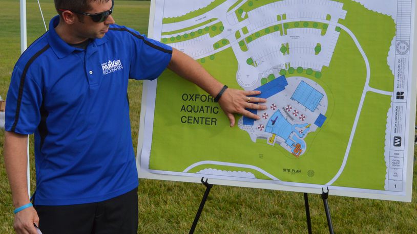 Oxford Director of Parks and Recreation Casey Wooddell describes what will be included in the city’s new aquatic center at a groundbreaking ceremony Aug. 7. CONTRIBUTED/BOB RATTERMAN