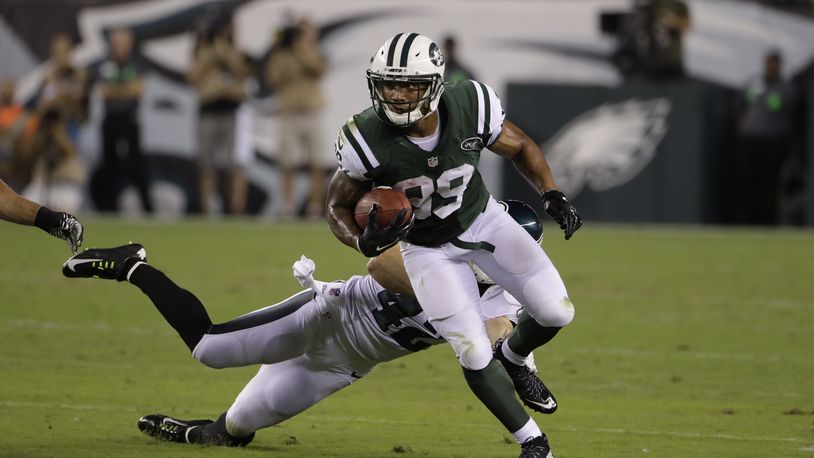 Jalin Marshall, of the New York Jets, runs with the ball against the Eagles’ Chris Maragos during the first half of a preseason game, Thursday, Sept. 1, 2016, in Philadelphia. (AP Photo/Matt Rourke)