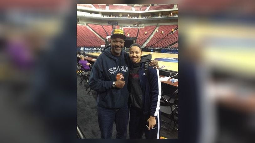 Hamilton legendary hoops star Greg Stokes poses with his daughter Kiah after a UConn basketball game.