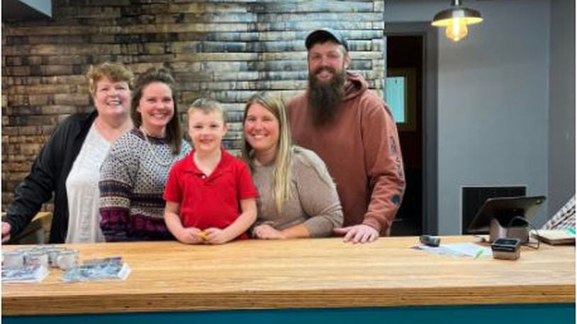 Rustic Home is reopening at a new location on Main Street. Pleased to be back in business after the move are, from left, Lori Noga, Erin Noga, Jackson Schwartz, Jessica Schwartz and Dan Schwartz. PROVIDED