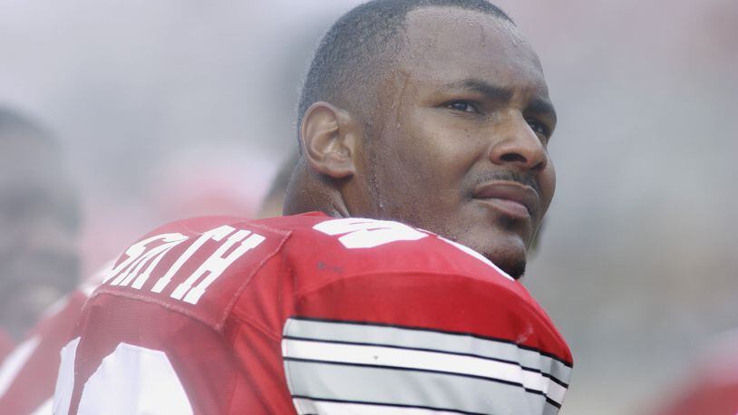 COLUMBUS, OH - AUGUST 24: Defensive end Will Smith #93 of the Ohio State Buckeyes sits on the bench during the NCAA Pigskin Classic against the Texas Tech Red Raiders on August 24, 2002 at Ohio Stadium in Columbus, Ohio. Ohio State defeated Texas Tech 45-21. (Photo by Mark Lyons/Getty Images)