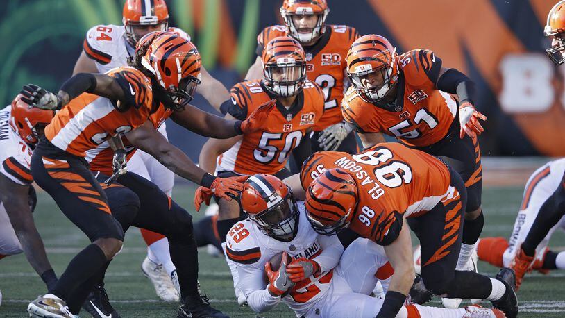 CINCINNATI, OH - NOVEMBER 26: Cincinnati Bengals defenders combine to tackle Duke Johnson Jr. #29 of the Cleveland Browns in the second half of a game at Paul Brown Stadium on November 26, 2017 in Cincinnati, Ohio. The Bengals won 30-16. (Photo by Joe Robbins/Getty Images)