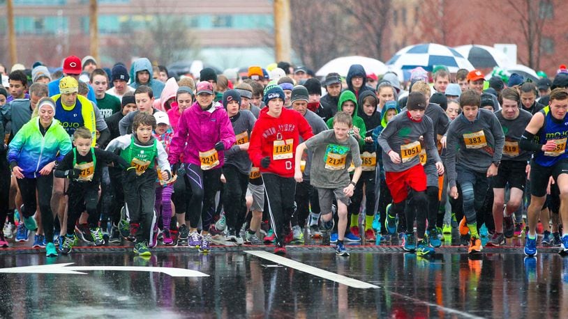 Runners participate in the 10th annual Shamrock Shuffle at the The Square @ Union Centre in West Chester Twp. Saturday, Mar. 19, 2016. GREG LYNCH / STAFF