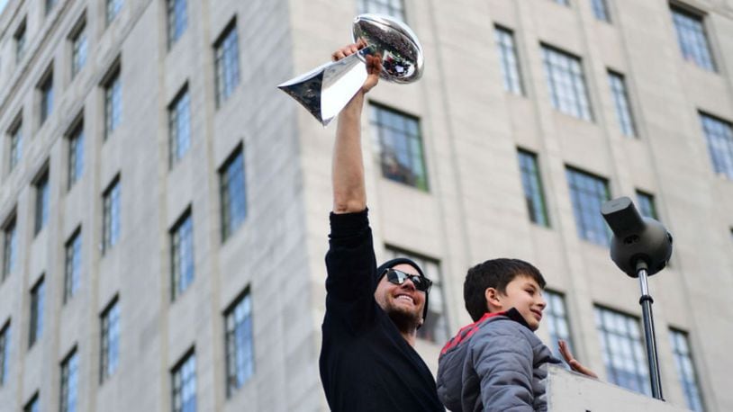 BOSTON, MASSACHUSETTS - FEBRUARY 05: Tom Brady #12 of the New England Patriots displays the Vince Lombardi trophy during the Super Bowl Victory Parade on February 05, 2019 in Boston, Massachusetts. (Photo by Billie Weiss/Getty Images)