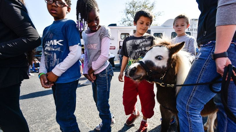 Shelby Reynolds, with Seven Oaks Farm, shows off a miniature horse named Toby Keith during an anti-bullying program at Riverview Elementary School Friday, Oct. 20 in Hamilton. NICK GRAHAM/STAFF