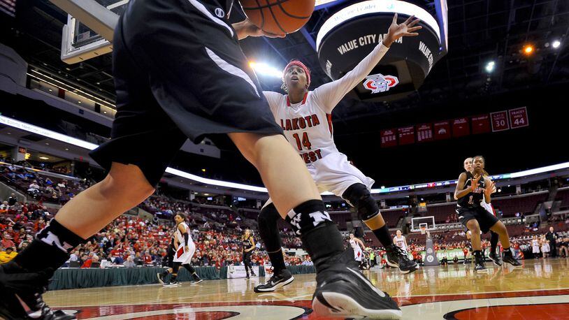 Lakota West’s Arianne Whitaker tries to stop an inbounds play during a Division I state basketball semifinal against Newark at the Schottenstein Center in Columbus on March 20, 2015. West won 53-50. NICK GRAHAM/STAFF