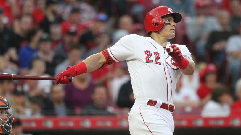The Reds’ Derek Dietrich hits a home run against the Giants on Friday, May 3, 2019, at Great American Ball Park in Cincinnati. David Jablonski/Staff