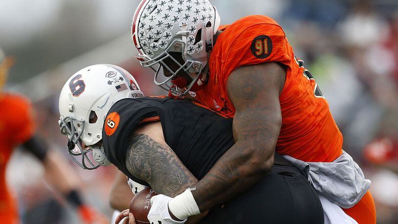 MOBILE, AL - JANUARY 27: Kurt Benkert #6 of the South team is sacked by Jalyn Holmes #91 of the North team during the first half of the Reese's Senior Bowl at Ladd-Peebles Stadium on January 27, 2018 in Mobile, Alabama.  (Photo by Jonathan Bachman/Getty Images)
