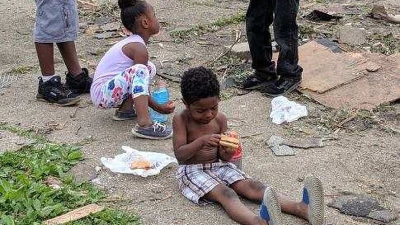 Children who live in one of the hardest hit areas in Trotwood were fed McDonald s hamburgers by Kingswell Seminary volunteers. SUBMITTED PHOTO
