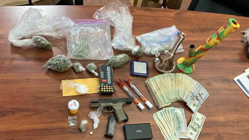 Drugs, money and a gun were confiscated Tuesday during a search warrant in Middletown. BUTLER COUNTY SHERIFF'S OFFICE