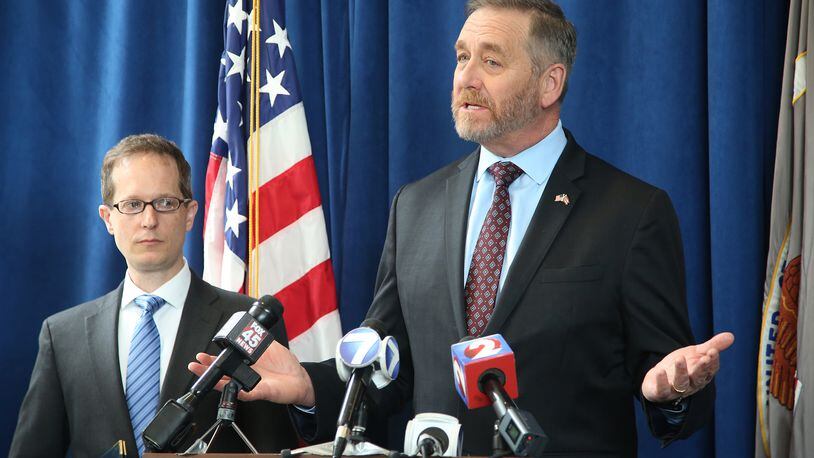 U.S. Attorney Benjamin C. Glassman (left) and Ohio Attorney General Dave Yost in an April 2019 file photo. LISA POWELL / STAFF