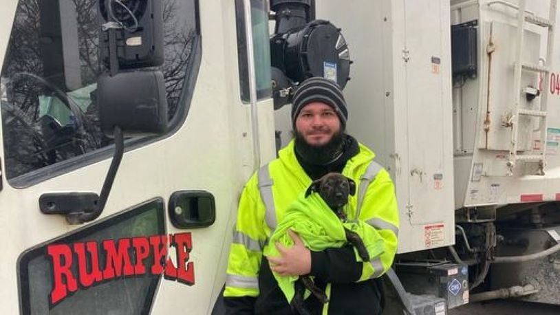 Rumpke driver Aaron Kinsel adopted "Tipper," a 10-week-old puppy he found abandoned inside a backpack along a Colerain Township road. PROVIDED