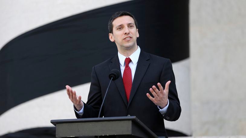 FILE - In this May 14, 2015, file photo, then-Cincinnati Councilman P.G. Sittenfeld speaks outside of the Ohio Statehouse, in Columbus, Ohio. The former Cincinnati councilman,'s upcoming bribery trial is set for later this month. (Courtney Hergesheimer/The Columbus Dispatch via AP, File)