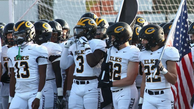 Centerville players, including Reggie Powers (3), wait to take the field before a game at Dublin Coffman on Aug. 25, 2023. David Jablonski/Staff