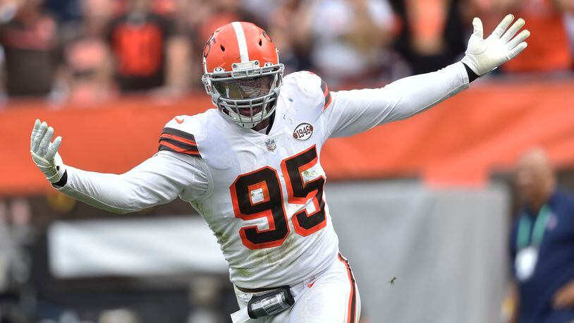 Cleveland Browns defensive end Myles Garrett celebrates after sacking Chicago Bears quarterback Justin Fields during the second half of an NFL football game, Sunday, Sept. 26, 2021, in Cleveland. (AP Photo/David Richard)