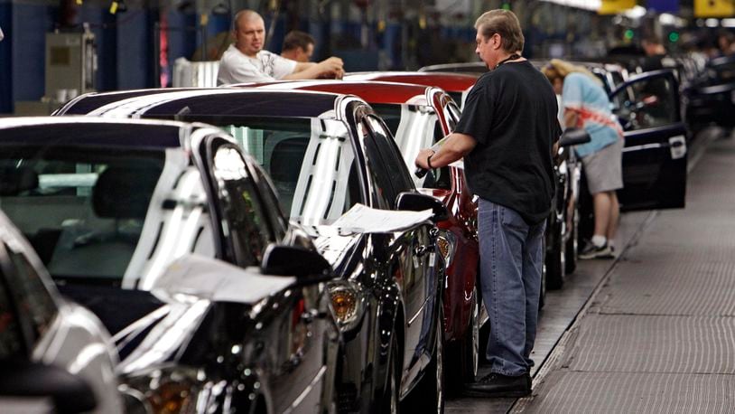 Workers at General Motors’ Lordstown Assembly plant in Lordstown, Ohio put the final touches on 2011 Chevrolet Cobalts in this file photo. AP Photo/Mark Duncan