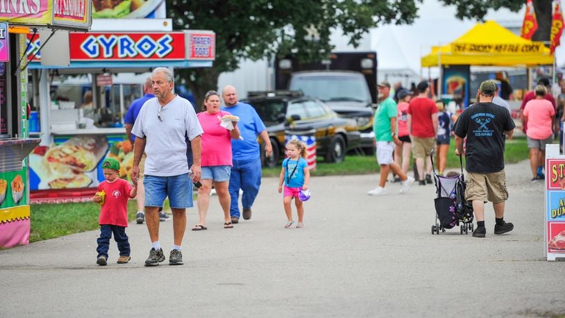 Fairgoers walk through the food vendor area at the Butler County Fair Monday, July 23 in Hamilton. NICK GRAHAM/STAFF