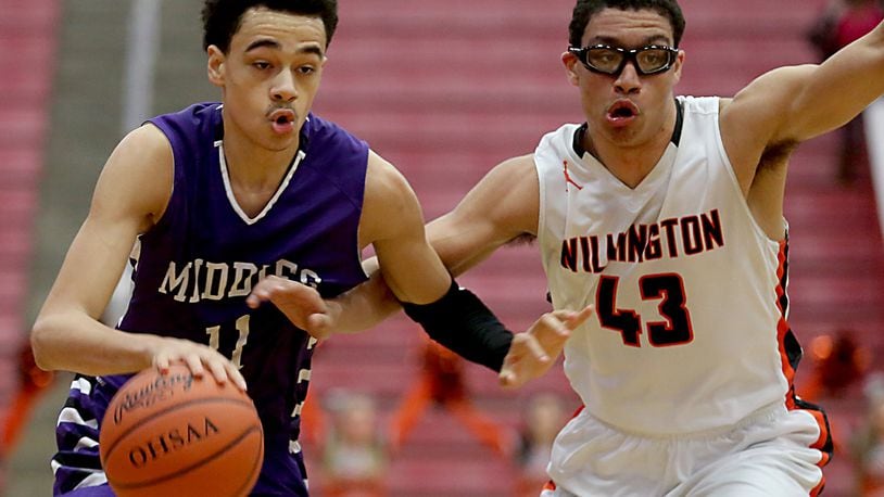 Middletown guard Clifton Snow is covered by Wilmington guard Jeffery Mansfield during their Division I sectional game at Fairfield Arena on Feb. 28, 2017. JOURNAL-NEWS FILE PHOTO