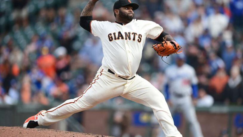 Pablo Sandoval of the San Francisco Giants shows his pitching form during the ninth inning of Saturday's doubleheader opener.