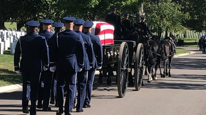 A caisson carries the remains of Maris McCrabb, a 25-year veteran of the U.S. Air Force during his funeral last week at Arlington National Cemetery. RICK McCRABB/STAFF