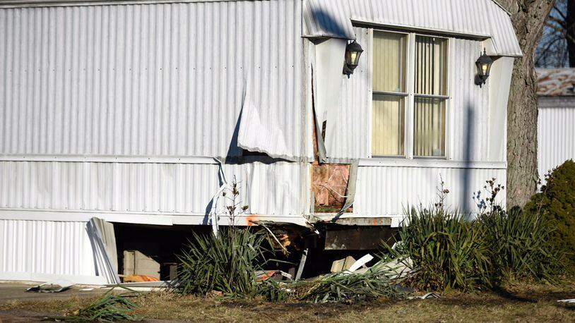The driver of a vehicle that crashed into this mobile home in the Riverside Village Trailer Park was pronounced dead at the scene. NICK GRAHAM/STAFF