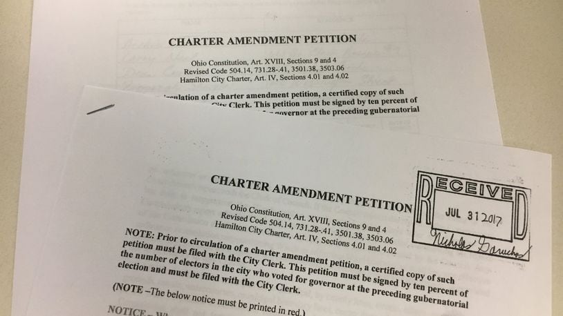 These petitions are being circulated by Citizens For Change to create term limits and require that four members of Hamilton City Council be elected from separate wards. MIKE RUTLEDGE/STAFF