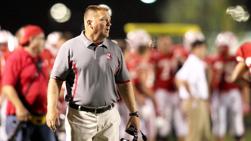 Lakota West coach Larry Cox paces the sideline during an Oct. 11, 2013, game against Fairfield at West. The host Firebirds won 35-3. FILE PHOTO