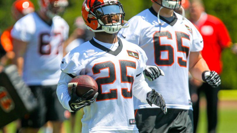 Bengals running back Giovani Bernard (25) runs a play during the first OTA practice of the year, Tuesday, May 24, 2016. GREG LYNCH / STAFF