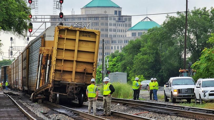A CSX freight train had a broken wheel while in transit, forcing it to stop. It blocked several intersections in Hamilton as a result on Wed., July 6, 2022. Crews separated cars near Hanover Street to unblock that intersection. NICK GRAHAM/STAFF