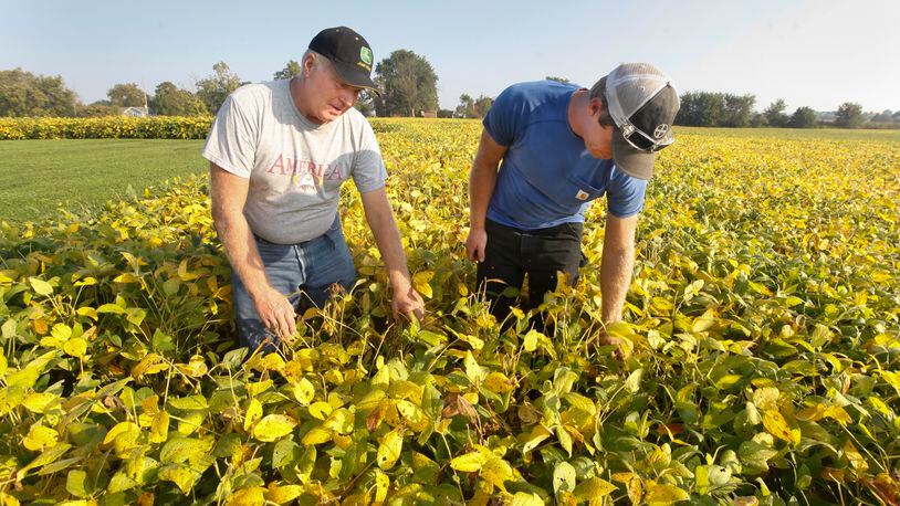 Dale Seim and his son Scott on their Perry Twp. farm in Montgomery County. CHRIS STEWART / STAFF