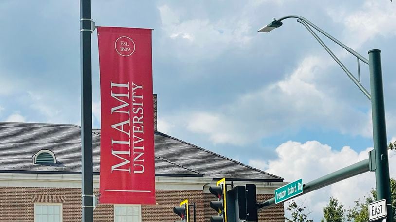 A Miami University banner hangs on a post, visible to those entering Oxford from Ohio 73. STAFF FILE PHOTO