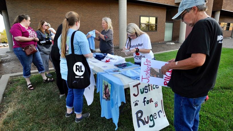 Protesters gathered outside Middletown Municipal Court on Friday, Aug. 9, 2019, for the arraignment of Charles Miller, who is charged with cruelty to a companion animal after allegedly hitting a German Shepherd in the head with a bat, and the dog later died. NICK GRAHAM / STAFF