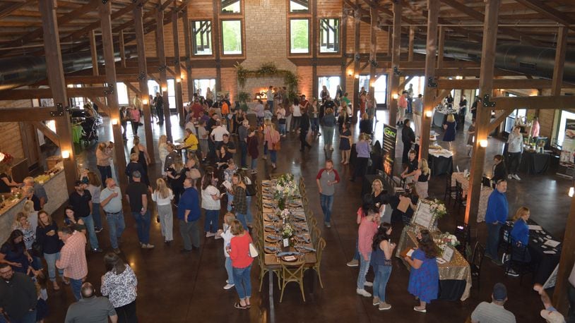 The size of the interior of the Hanover Reserve facility can be seen in this photo taken from the second-floor landing during the opening in May. A table was set as if for a reception or banquet with vendors set up on the right offering food samples and other services. CONTRIBUTED/BOB RATTERMAN