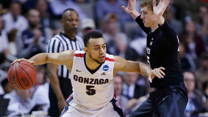 Gonzaga guard Nigel Williams-Goss (5) is defended by Xavier guard J.P. Macura during the second half of an NCAA Tournament college basketball regional final game Saturday, March 25, 2017, in San Jose, Calif. (AP Photo/Tony Avelar)