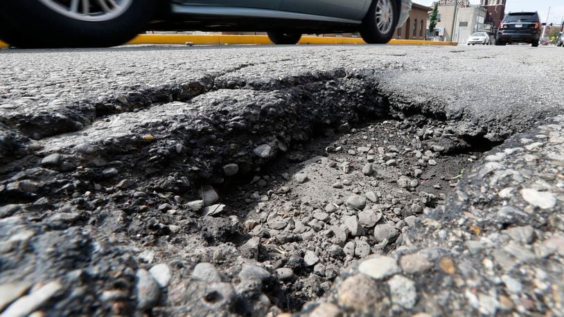 The Butler County Engineer’s Office plans to spend about $500,000 more to resurface roads in 2018. STAFF FILE PHOTO