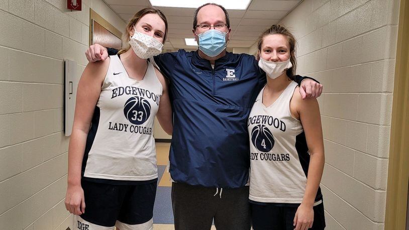 Edgewood girls basketball coach Matt Tolliver with leading scorers Callie Hunt (left) and Chloe Butler (right). CONTRIBUTED