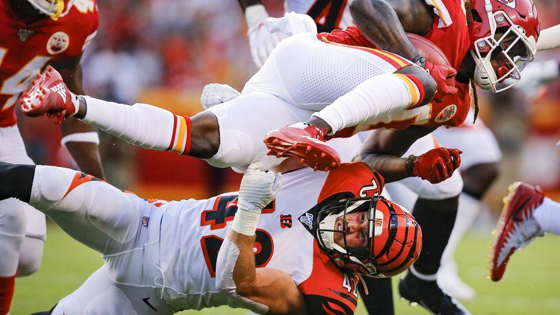 KANSAS CITY, MO - AUGUST 10: Tremon Smith #20 of the Kansas City Chiefs is tackled on a kick return by Clayton Fejedelem #42 of the Cincinnati Bengals in the first quarter during a preseason game at Arrowhead Stadium on August 10, 2019 in Kansas City, Missouri. (Photo by David Eulitt/Getty Images) ***BESTPIX***