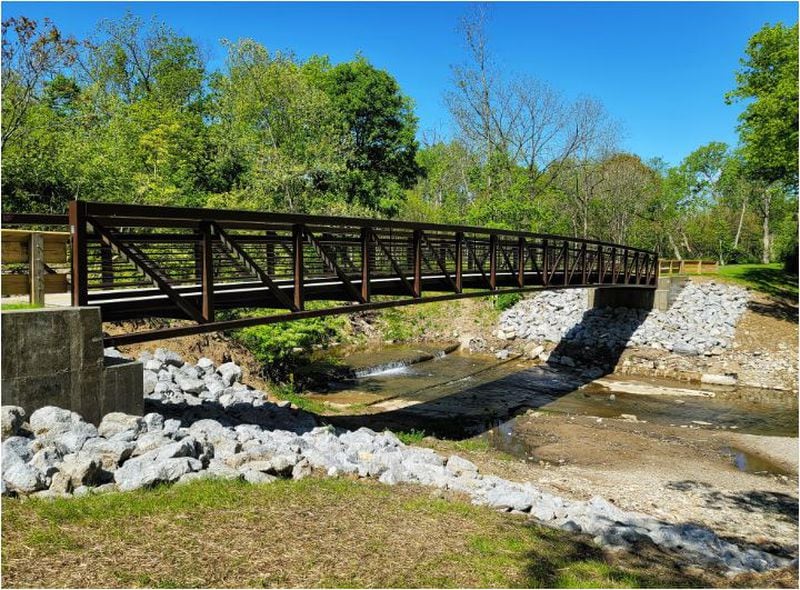This bridge along the Hamilton Beltline spans Two Mile Creek and overlooks a small waterfall that people enjoy looking at. NICK GRAHAM / STAFF