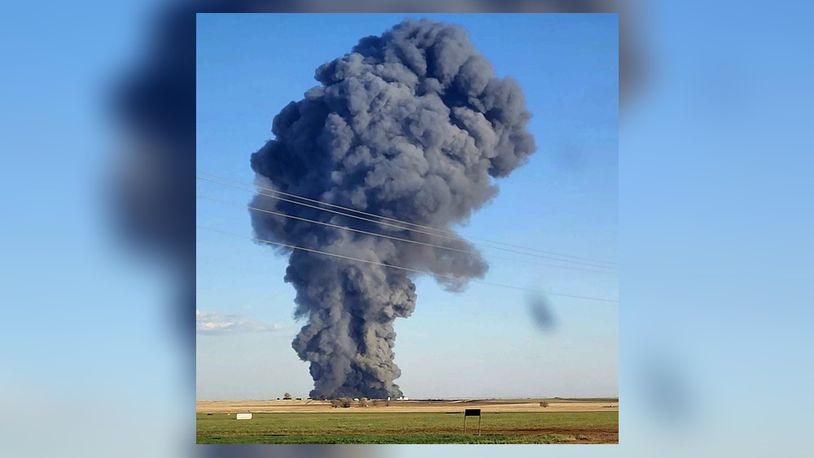 In this photo provided by Castro County Emergency Management, smoke fills the sky after an explosion and fire at the Southfork Dairy Farms near Dimmitt, Texas, on Monday, April 10, 2023. The explosion at the dairy farm in the Texas Panhandle that critically injured one person and killed an estimated 18,000 head of cattle is the deadliest barn fire recorded since the Animal Welfare Institute began tracking the fires. (Castro County Emergency Management via AP)