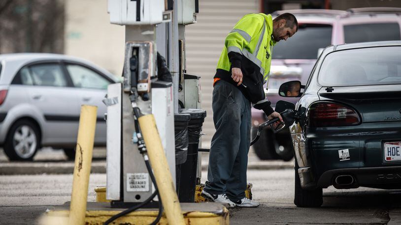 William Bussell, of Dayton, fills-up his vehicle for $3.85 a gallon at Big Daddy's Mini Mart & Gas on East Third Street in Dayton Thursday, March 24, 2022. Gas prices are dropping for now, but experts warn that motorists shouldn't get too used to it. JIM NOELKER/STAFF