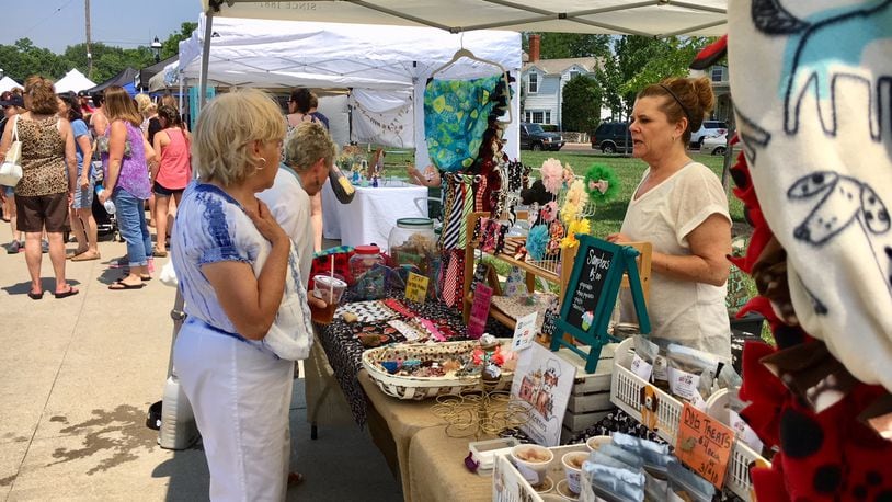 The Hamilton Flea market attracts lots of shoppers and people hanging out listening to live music and eating at various food trucks. It is open on the second Saturday of each month through the Summer season at Marcum Park in downtown Hamilton. FILE PHOTO