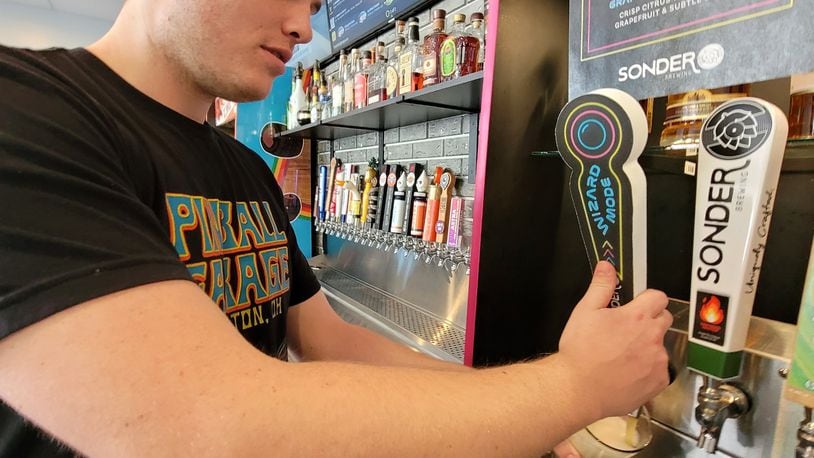 Pinball Garage in Hamilton has a new beer on tap, a collaboration with Sonder Brewing in Mason. The beer is Wizard Mode grapefruit white ale, a crisp citrus with tangy grapefruit and subtle spice. NICK GRAHAM / STAFF
