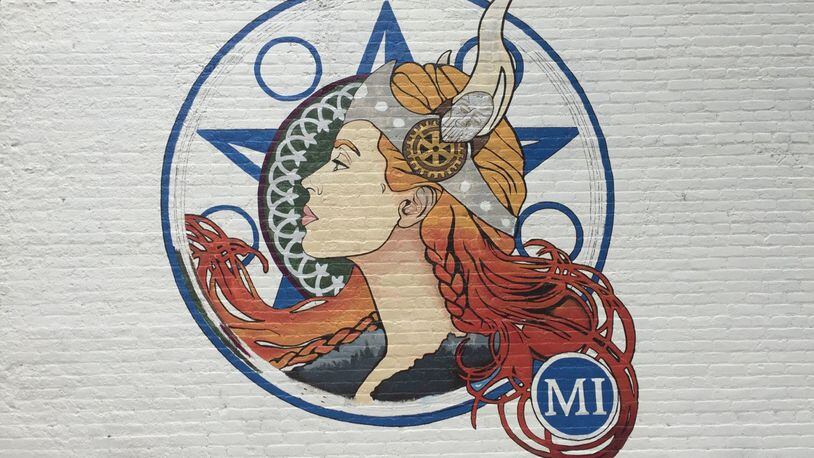 A mural of a lady viking painted on Miamsburg’s Gwinner Building. CONTRIBUTED