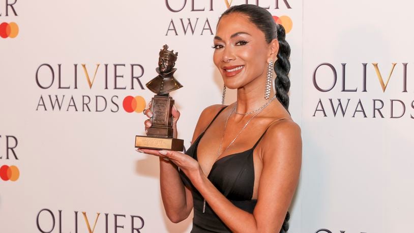Nicole Scherzinger, winner of the best actress in a musical award for "Sunset Boulevard", poses for photographers in the winner's room during the Olivier Awards on Sunday, April 14, 2024, in London. (Photo by Vianney Le Caer/Invision/AP)