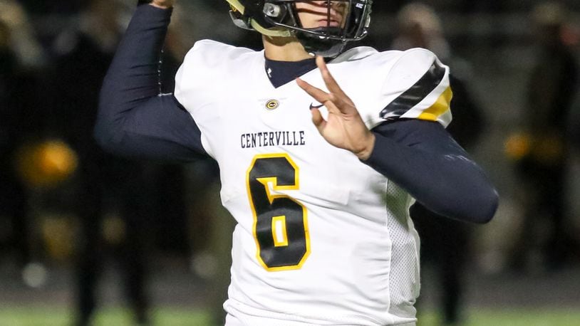 Centerville High School quarterback Chase Harrison throws a pass during their game on Thursday night at Springfield High School. The Wildcats won 41-28. CONTRIBUTED PHOTO BY MICHAEL COOPER