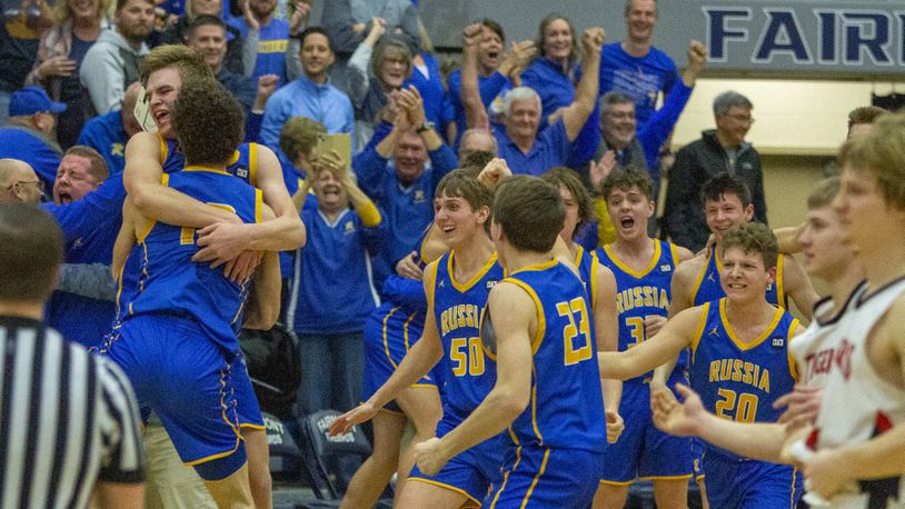 Russia’s boys basketball team celebrates its 27-25 victory over Jackson Center in the Region IV final at Trent Arena in Kettering on Friday, March 10, 2023. CONTRIBUTED/Jeff Gilbert
