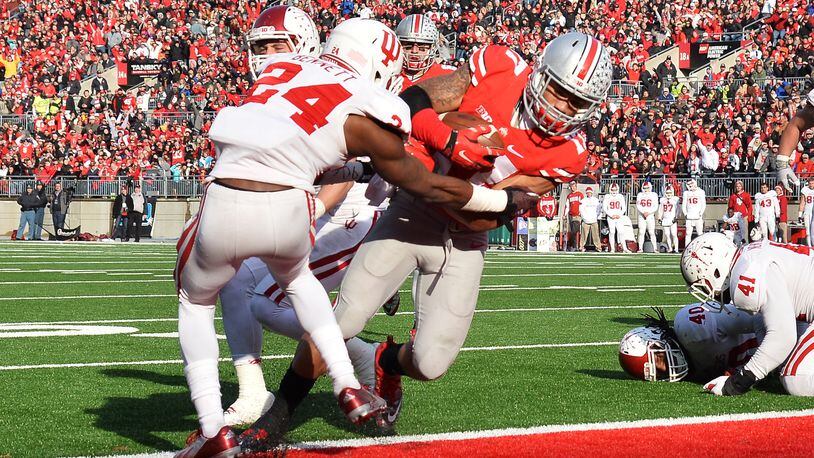 COLUMBUS, OH - NOVEMBER 22:  Jalin Marshall #17 of the Ohio State Buckeyes scores on a six-yard touchdown pass reception in the fourth quarter against the Indiana Hoosiers at Ohio Stadium on November 22, 2014 in Columbus, Ohio. Marshall scored four touchdowns in the second half to pace Ohio State to a 42-27 victory over Indiana.  (Photo by Jamie Sabau/Getty Images)