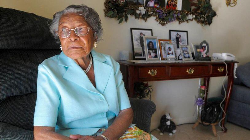 FILE - In this Oct. 7, 2010 file photo, Recy Taylor poses for a photo in her home in Winter Haven, Fla. Taylor, a black Alabama woman whose rape by six white men in 1944 drew national attention, died Thursday, Dec. 28, 2017, according to her brother Robert Corbitt. She was 97. (AP Photo/Phelan M. Ebenhack, File)