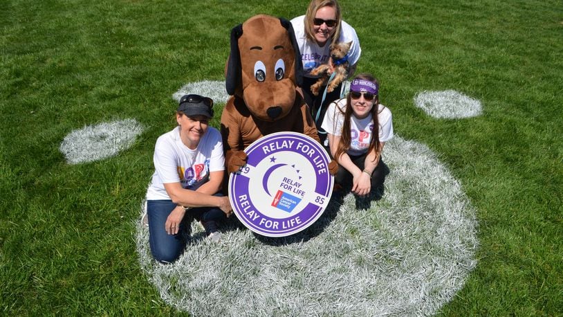 Theresa Baker, Kent Baker (in dog costume) Addie VonDenBenken and Lakota West student Abby Porter pose for a photograph during the inaugural Bark for Life event in 2016. The second annual West Chester Bark for Life is scheduled for April 1, 2017, at Voice of America MetroPark.